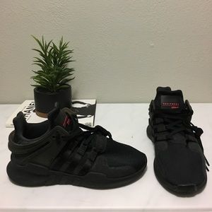 All black Adidas EQTs